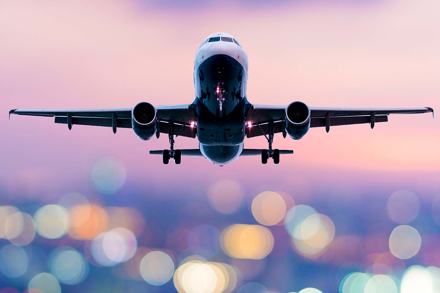 A plane taking off at dusk