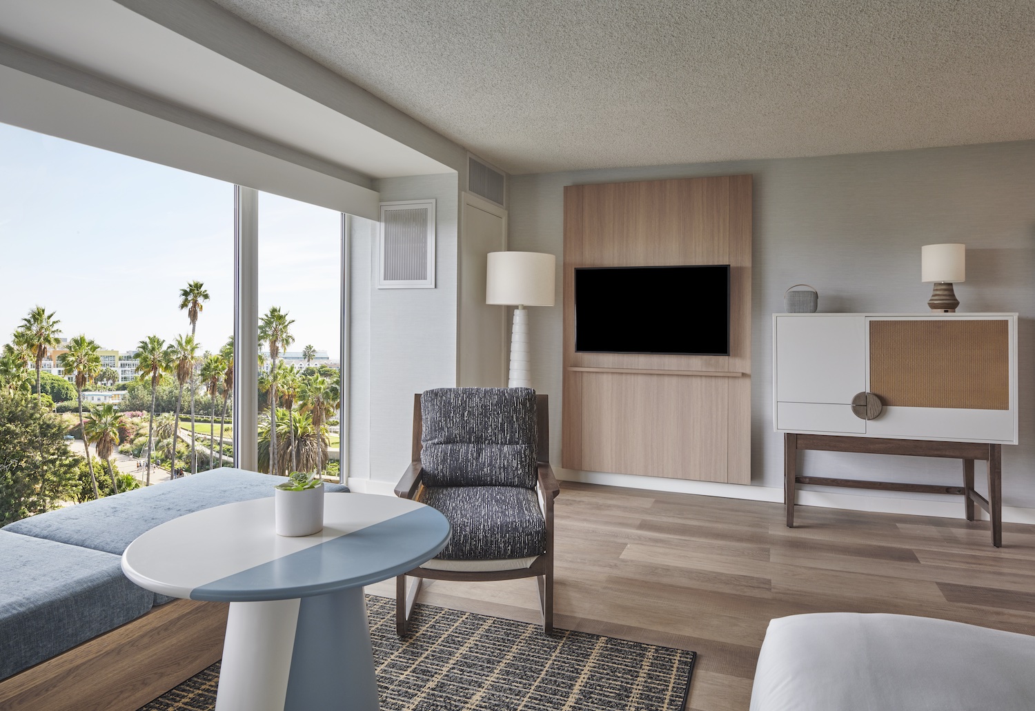 Living room are in a hotel with floor-to-ceiling window