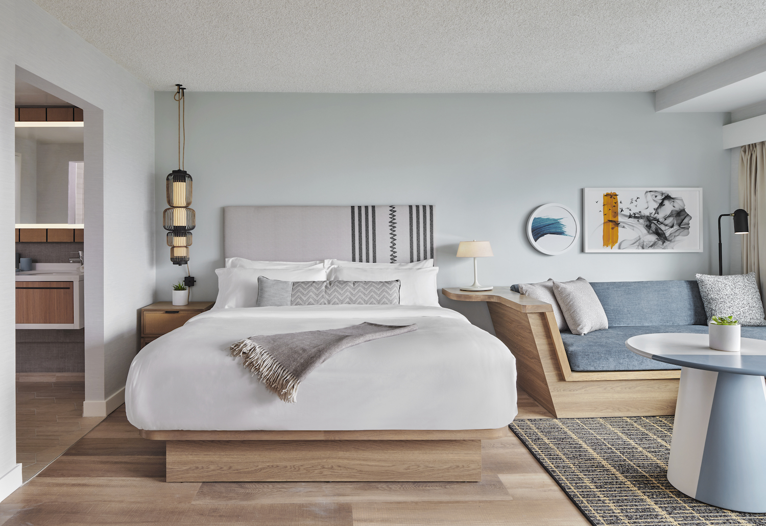 Bed and couch in a hotel room