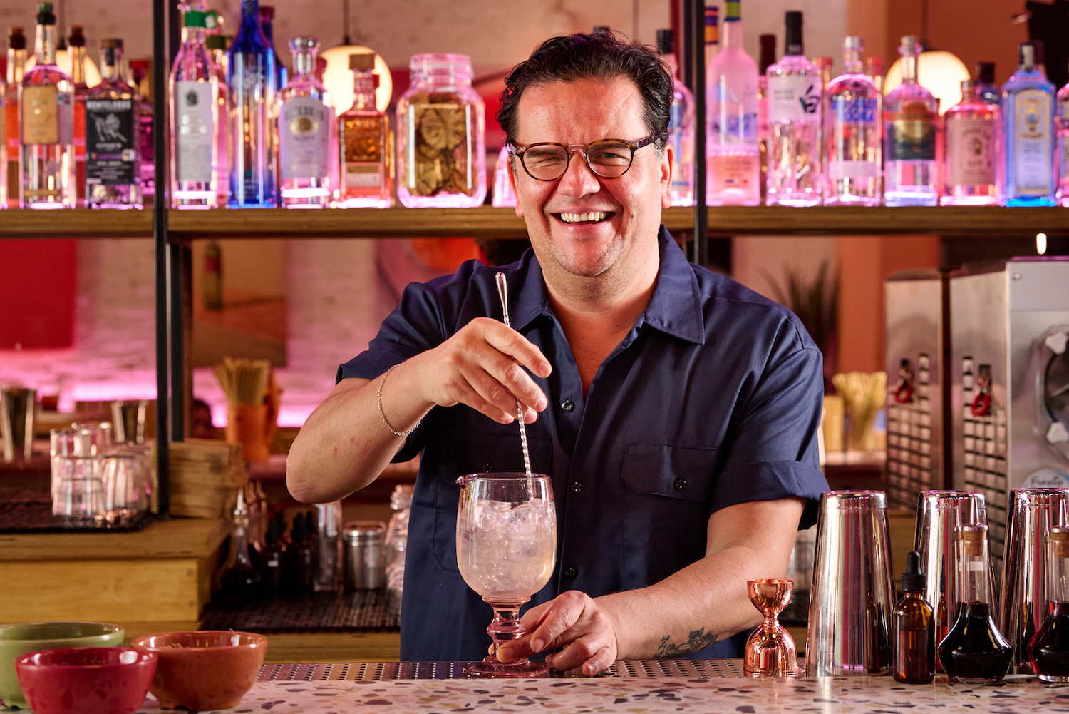 Ignacio "Nacho" Jimenez stirring a drink in superbueno