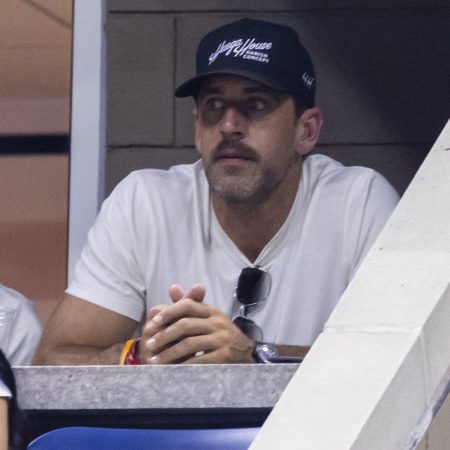 Aaron Rogers watches Novak Djokovic during the US Open.
