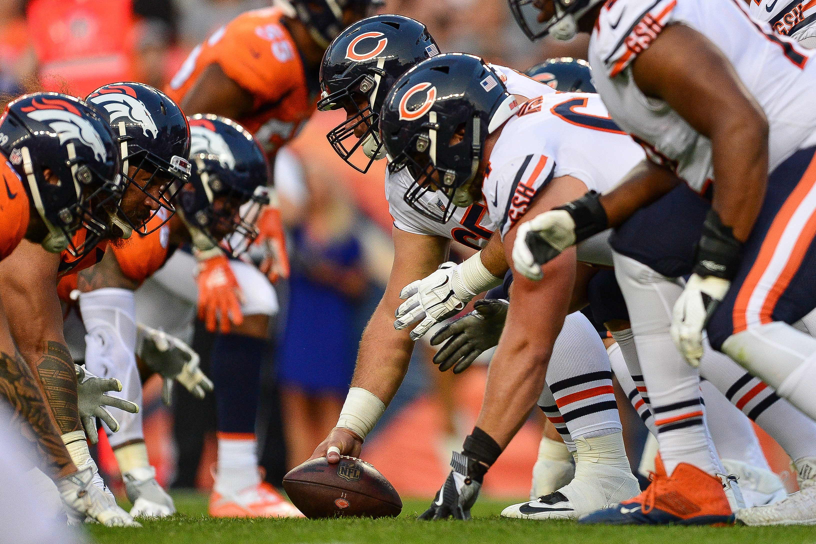 The Chicago Bears and Denver Broncos line up during a preseason game.