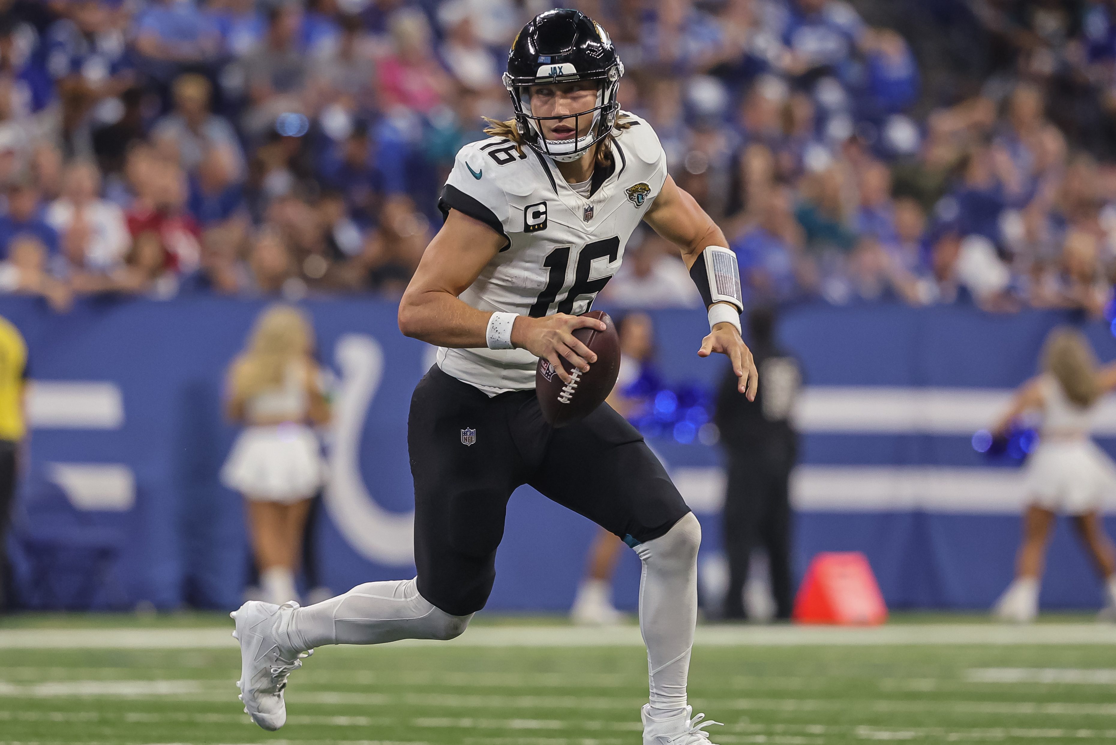 Trevor Lawrence of the Jaguars rolls out to pass.