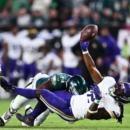 Minnesota running back Alexander Mattison fumbles the ball.