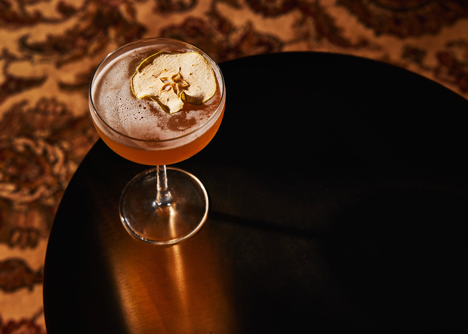 Martini glass with dried apple slice rim