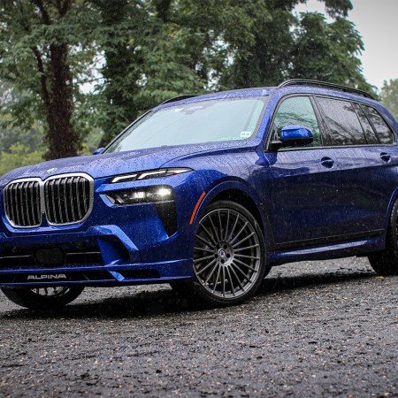 2023 BMW Alpina XB7 SUV in blue sitting in the rain