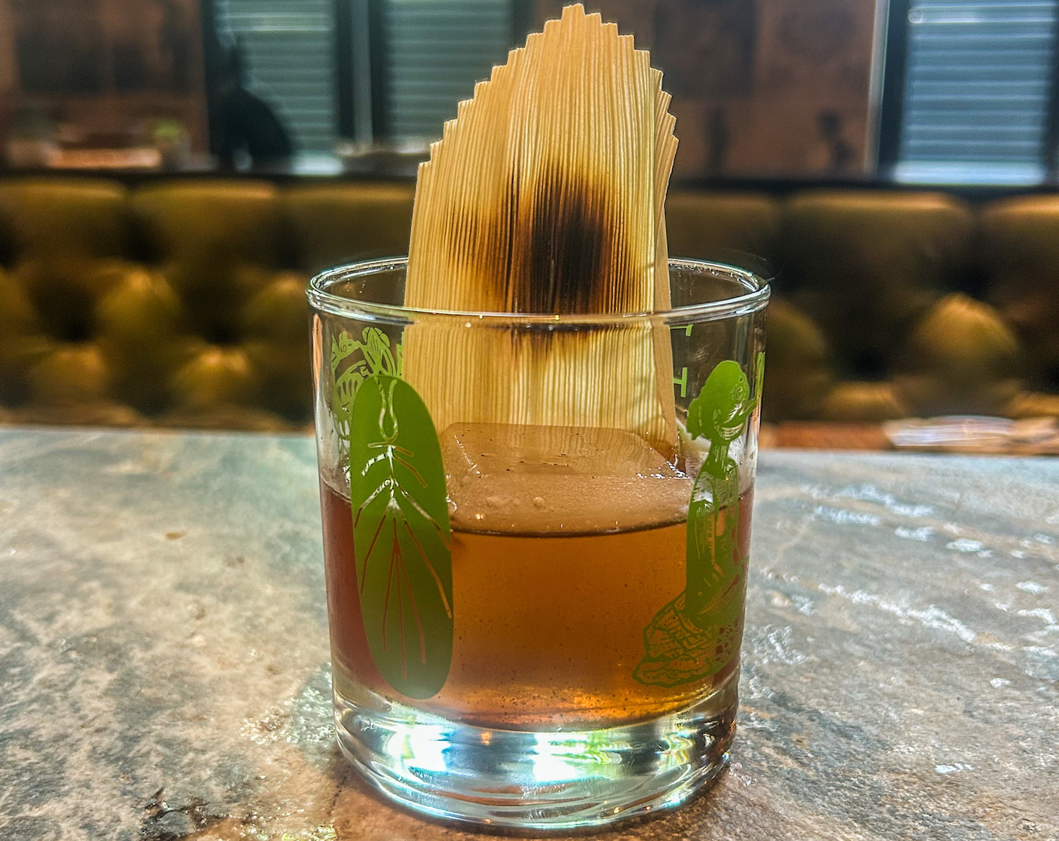 Whiskey in a glass with a garnish