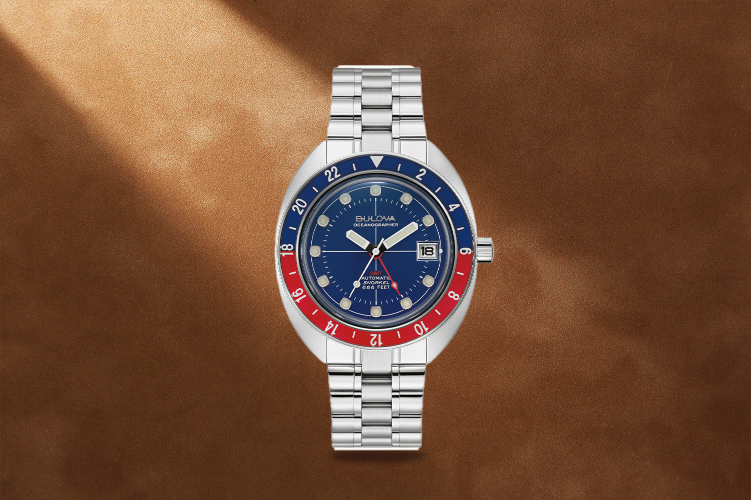 Silver, blue and red watch