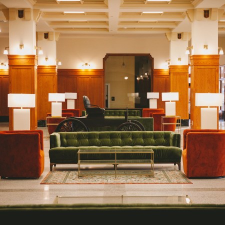 Lobby with brown and green decor accents in the Crazy Water Hotel