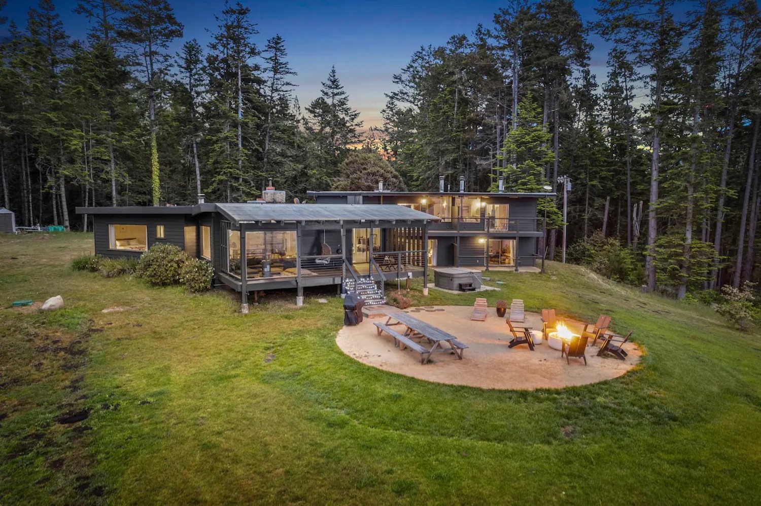 Dark-colored lodge in a grassy area
