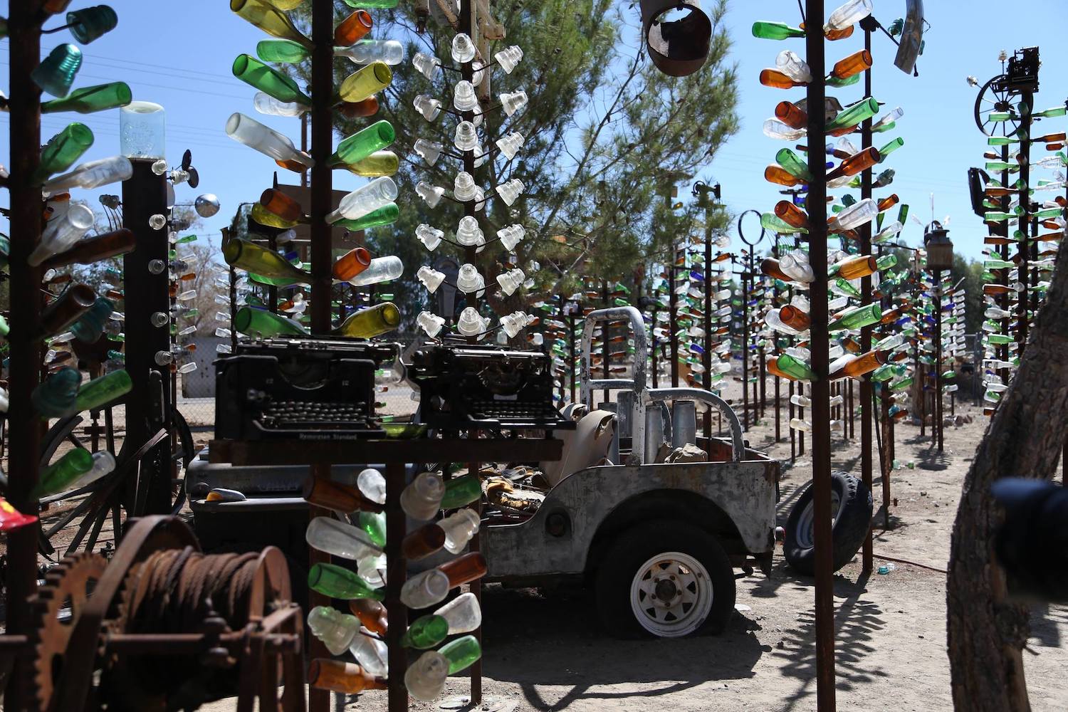 Glass bottles hanging off of pole