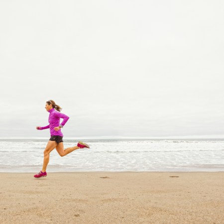Woman out for a training run on the beach in Santa Monica, CA