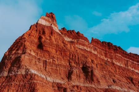 Layers of sedentary rock on the walls of the Palo Duro Canyon State Park in Canyon, Texas. The white lines in the walls of the canyon are formed from minerals of ancient lake beds that evaporated