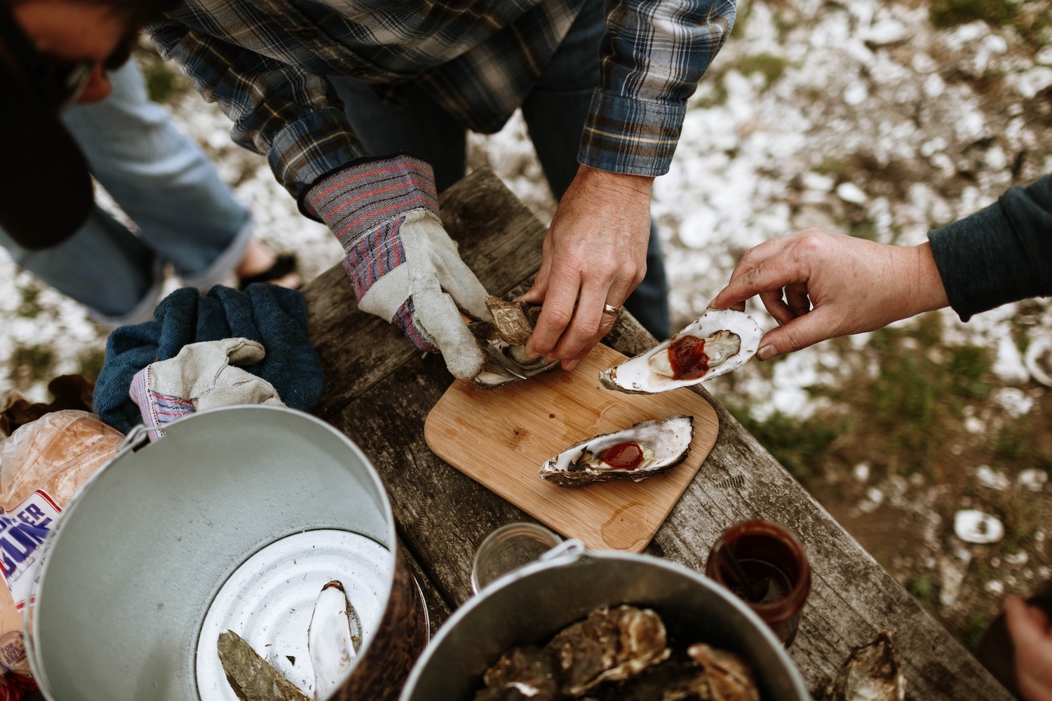 People preparing oysters