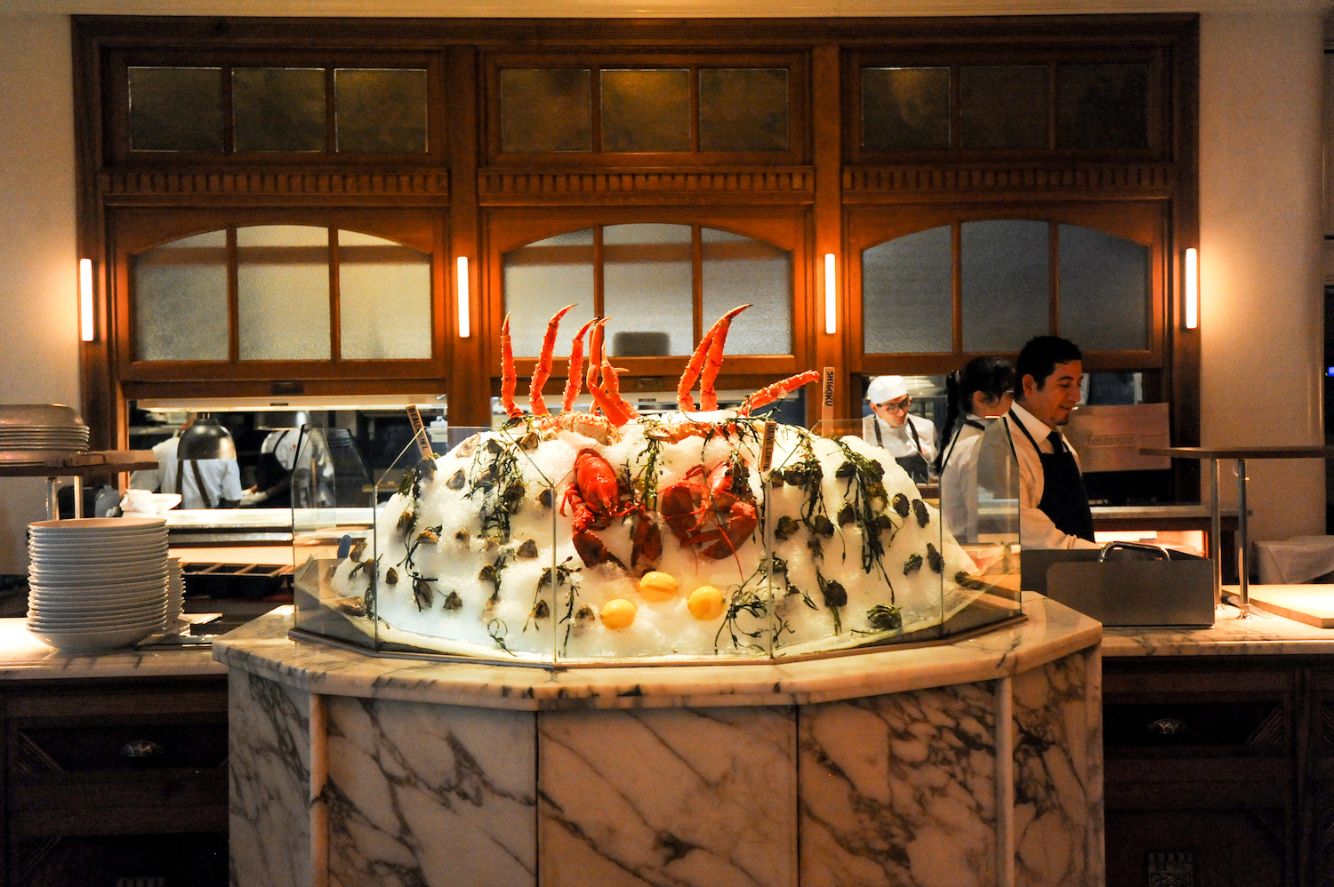 Container of ice on display with crab legs in it