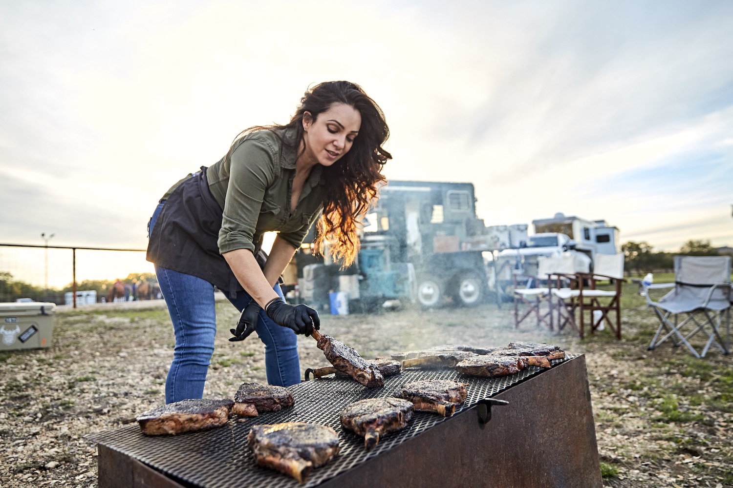 Jess Pryles grilling meat