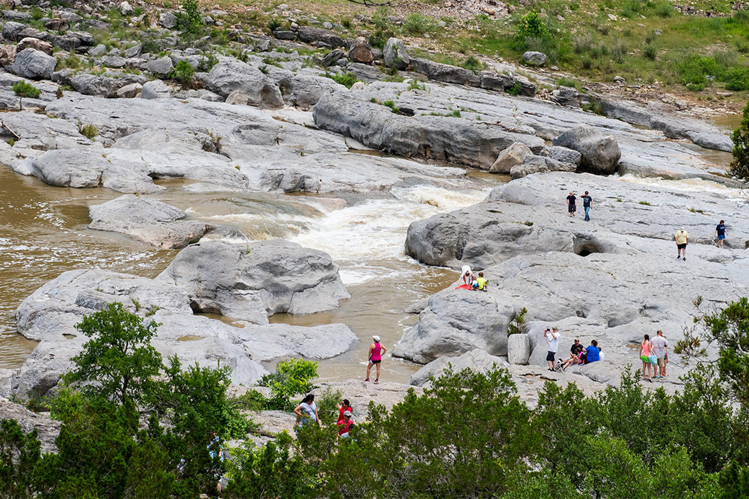 Water rushing down walks with people on them