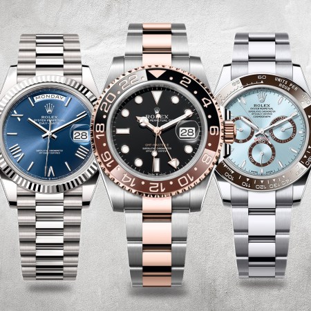 Three silver watches with blue and pink accents