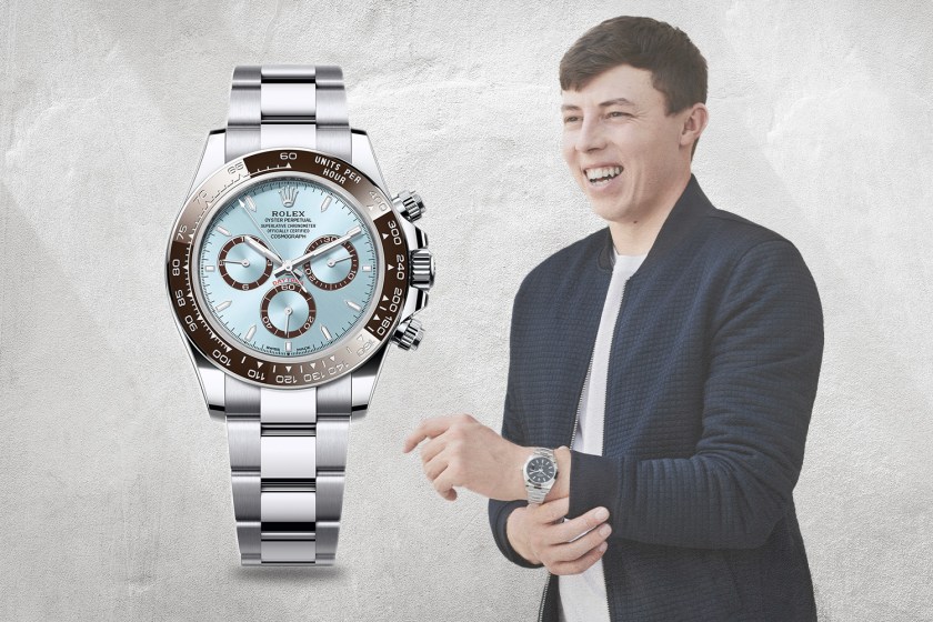 Silver and blue watch next to Matt Fitzpatrick