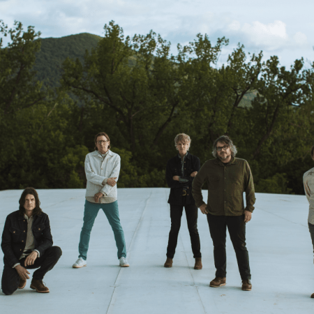 the band wilco standing on a frozen pond