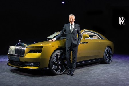 Rolls-Royce Motors Cars CEO Torsten Müller-Ötvös, who announced his retirement on October 5, next to the company's first EV, the Spectre