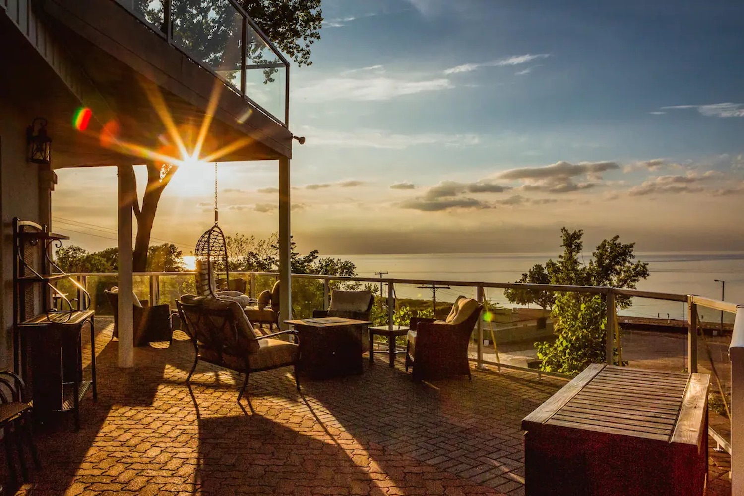 Patio with furniture overlooking scenic sunset view