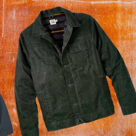 Three waxed trucker jackets on an orange background