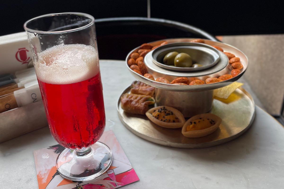 A drink and snacks at an Italian bar during aperitivo hour