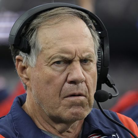 New England coach Bill Belichick stands on the sideline.