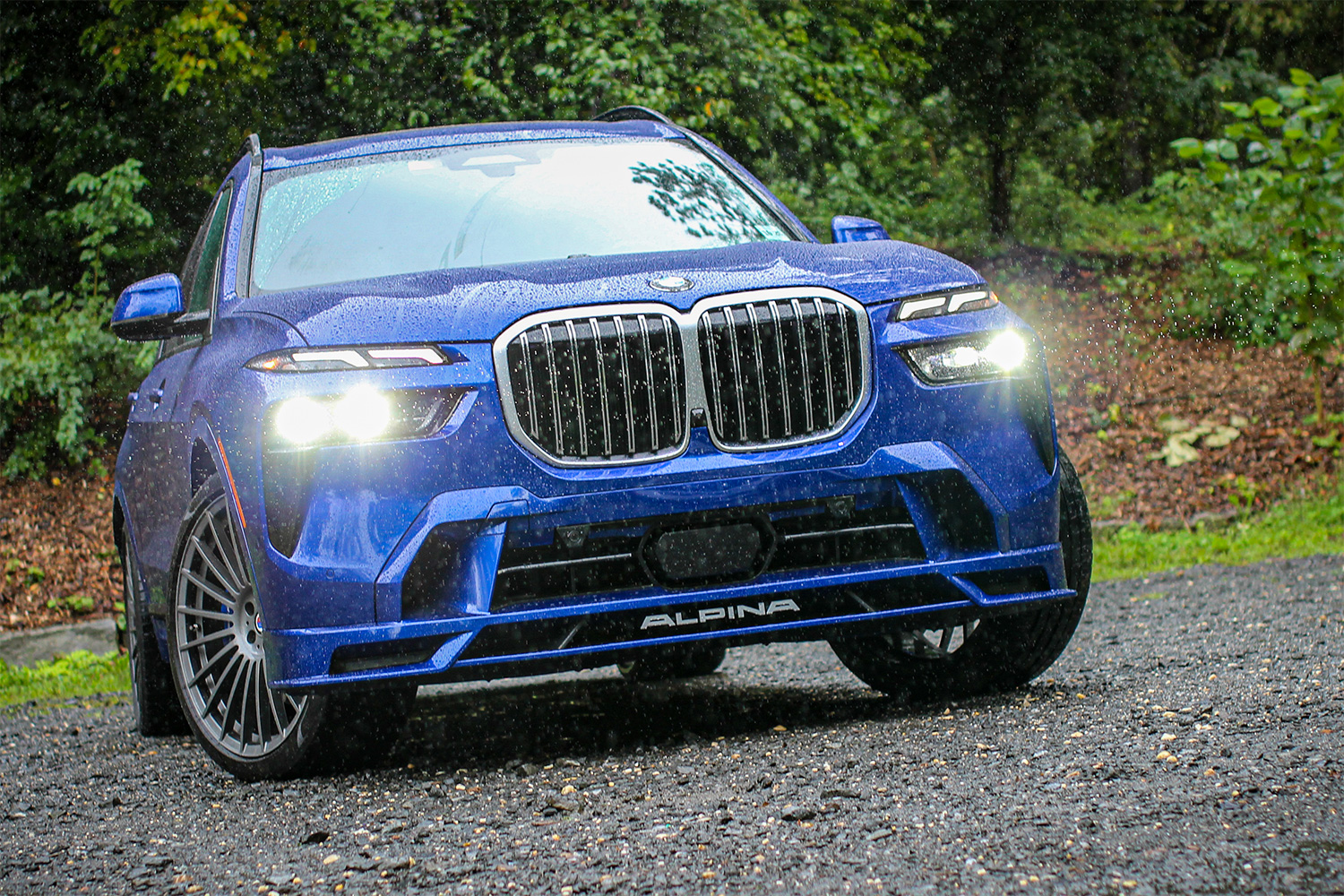 The BMW Alpina XB7 SUV with its headlights on