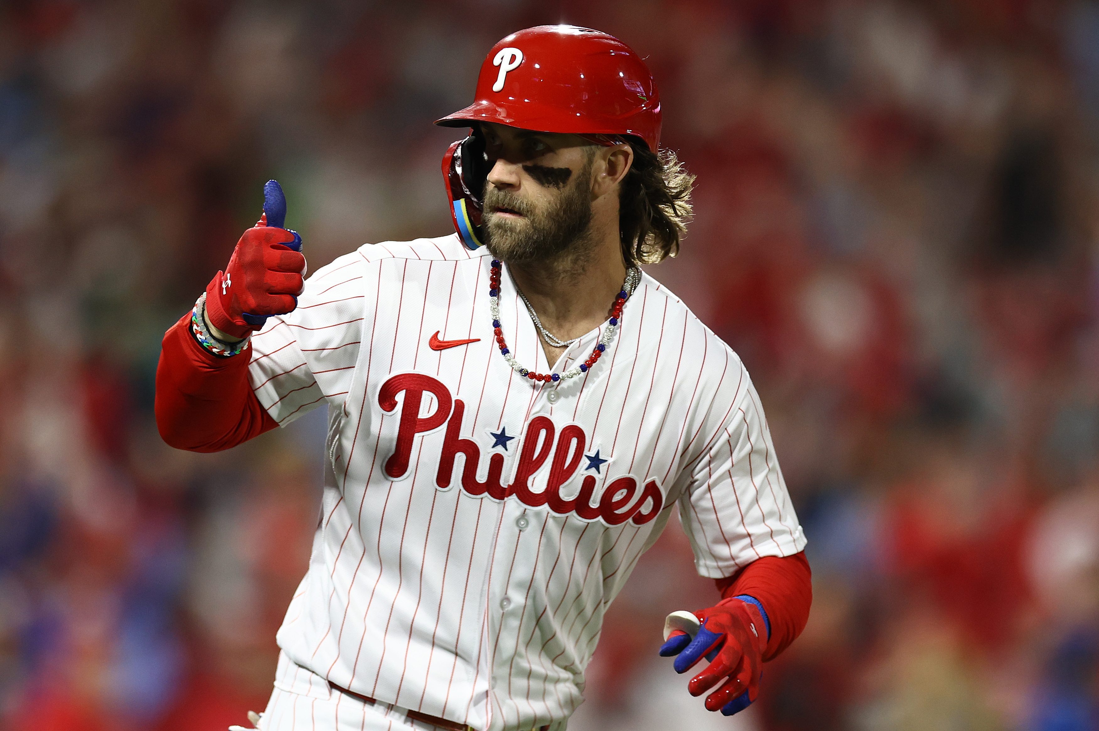 Bryce Harper of the Phillies reacts after hitting a solo home run.