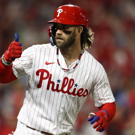 Bryce Harper of the Phillies reacts after hitting a solo home run.