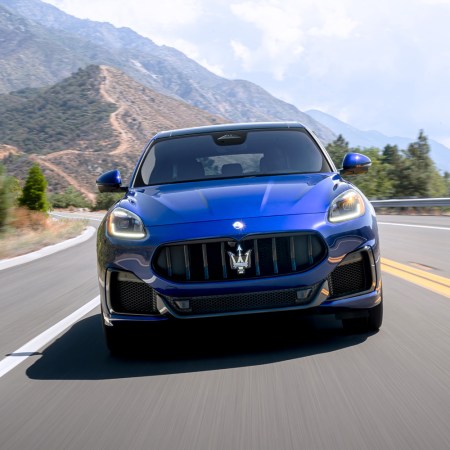 2023 Maserati Grecale Trofeo crossover in blue driving down the road