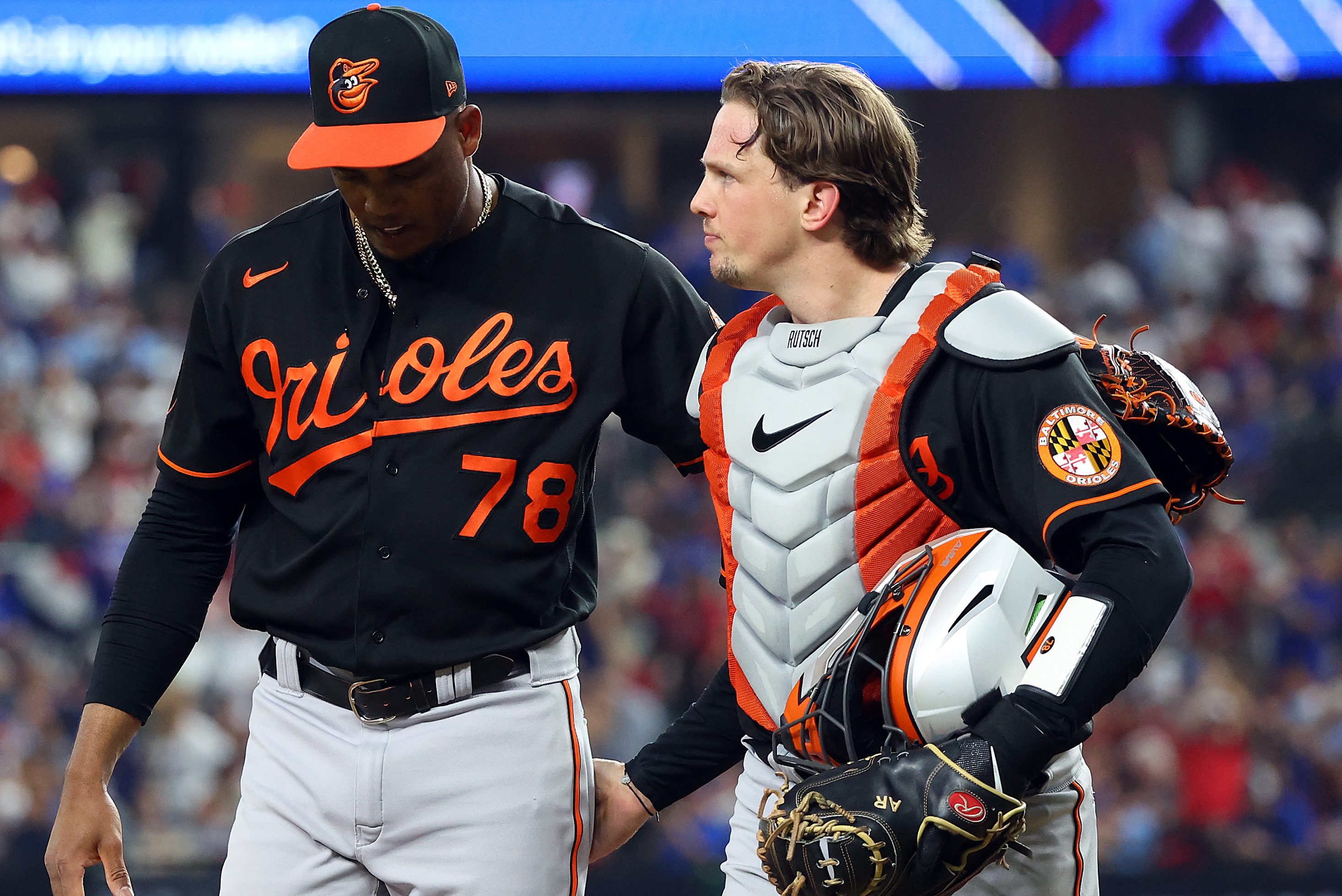 Baltimore Orioles players walk back to the dugout.