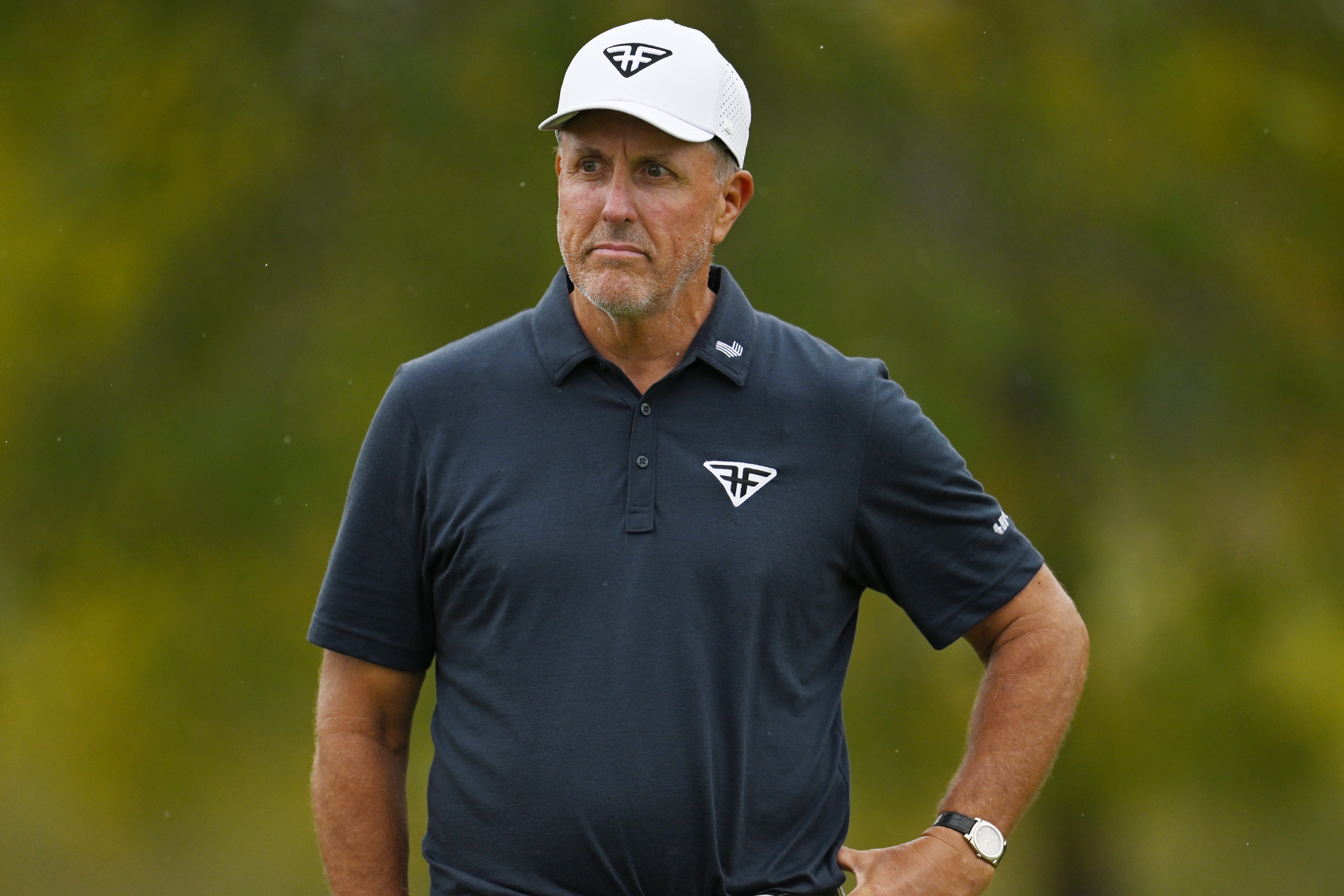 Phil Mickelson reacts after a putt at the LIV Golf Invitational - Chicago.