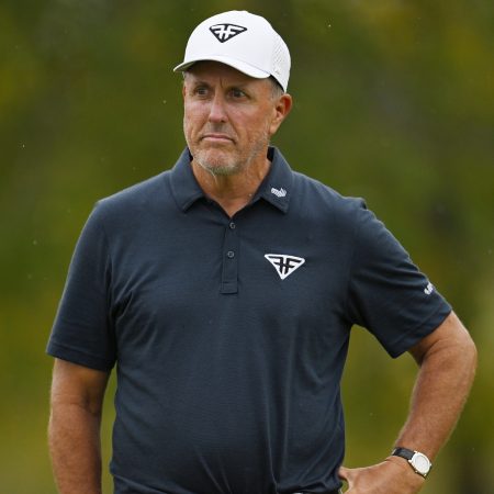 Phil Mickelson reacts after a putt at the LIV Golf Invitational - Chicago.
