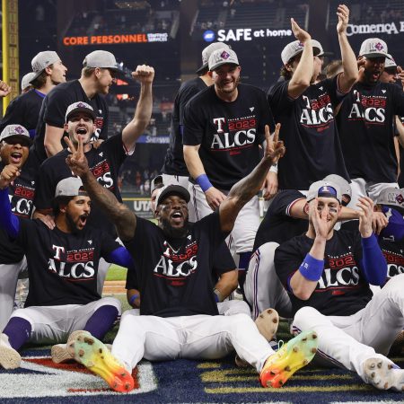 Texas players celebrate after defeating the Orioles in the Divisional Series.