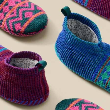 a photo of the Bombas slipper on a tan background
