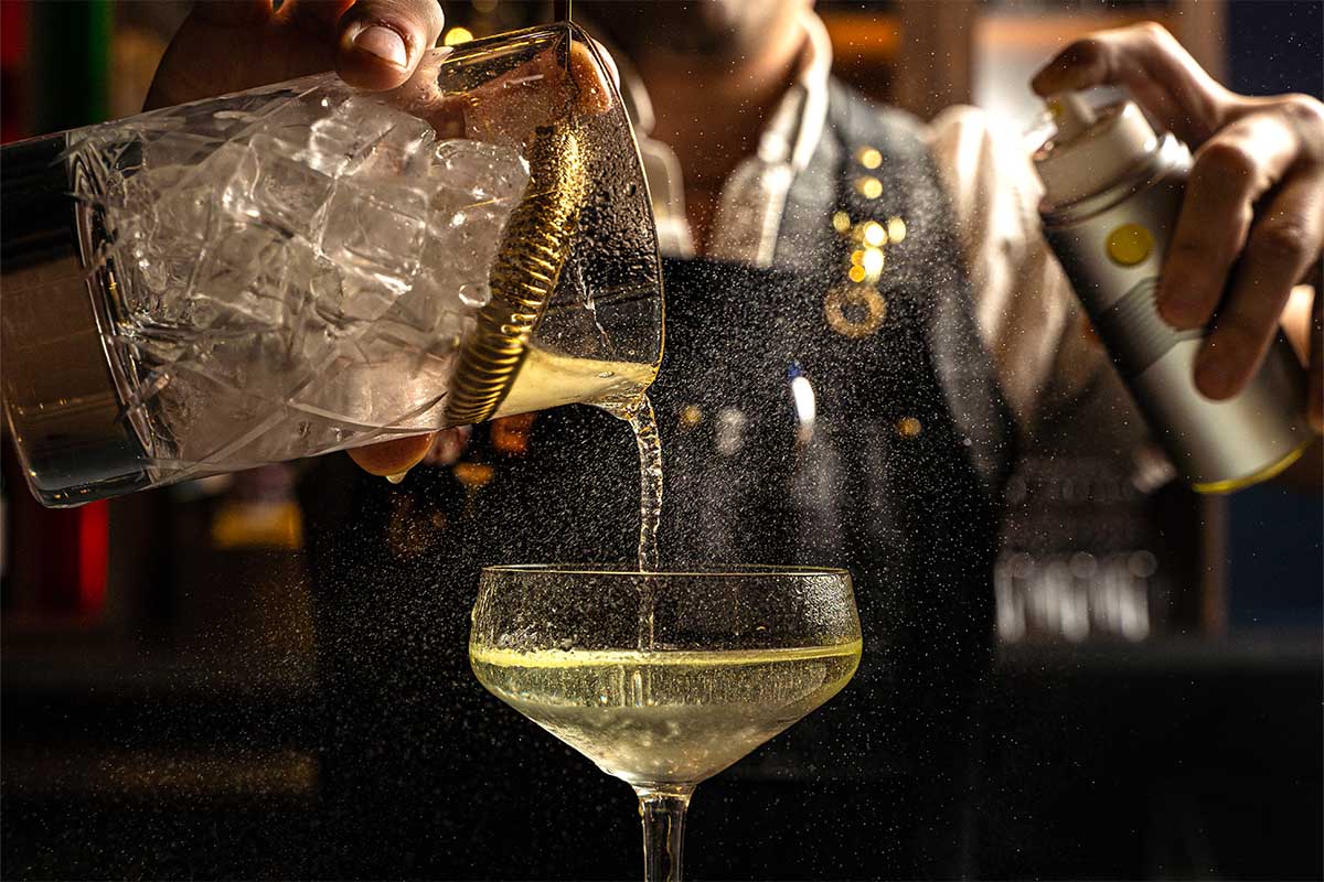 A bartender crafting a drink at Toronto's CKTL & Co.