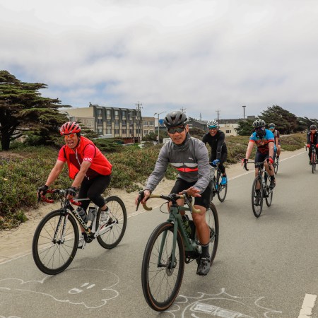 Cyclists ride their bikes on Great Highway