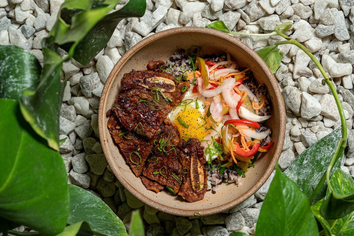 Hiraya's Filipino Breakfast bowls with meat, rice, eggs, peppers and onions