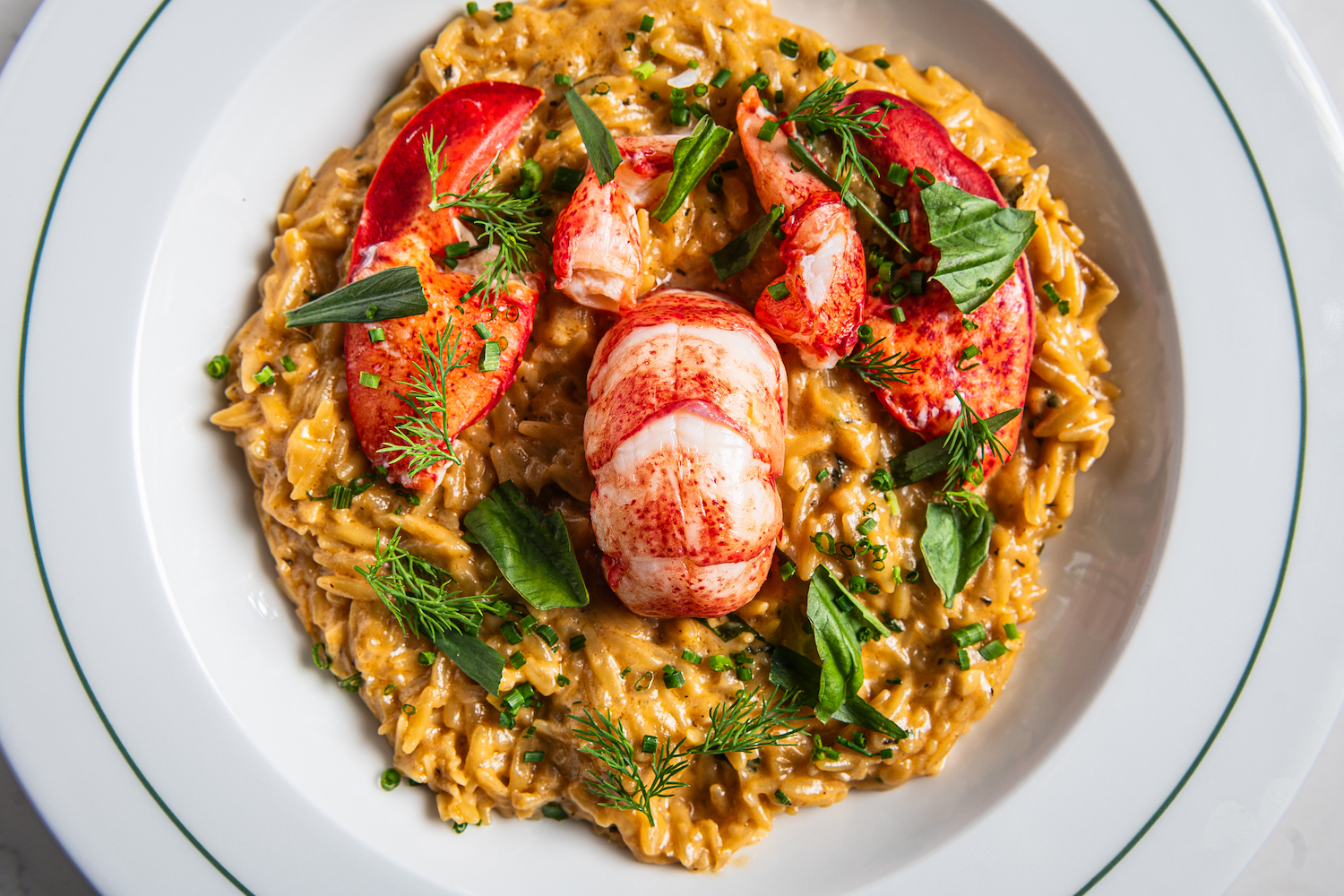 Orzo Al’Homard, made with Butter-Poached Lobster, Orzo Risotto, Truffled Crème Fraiche