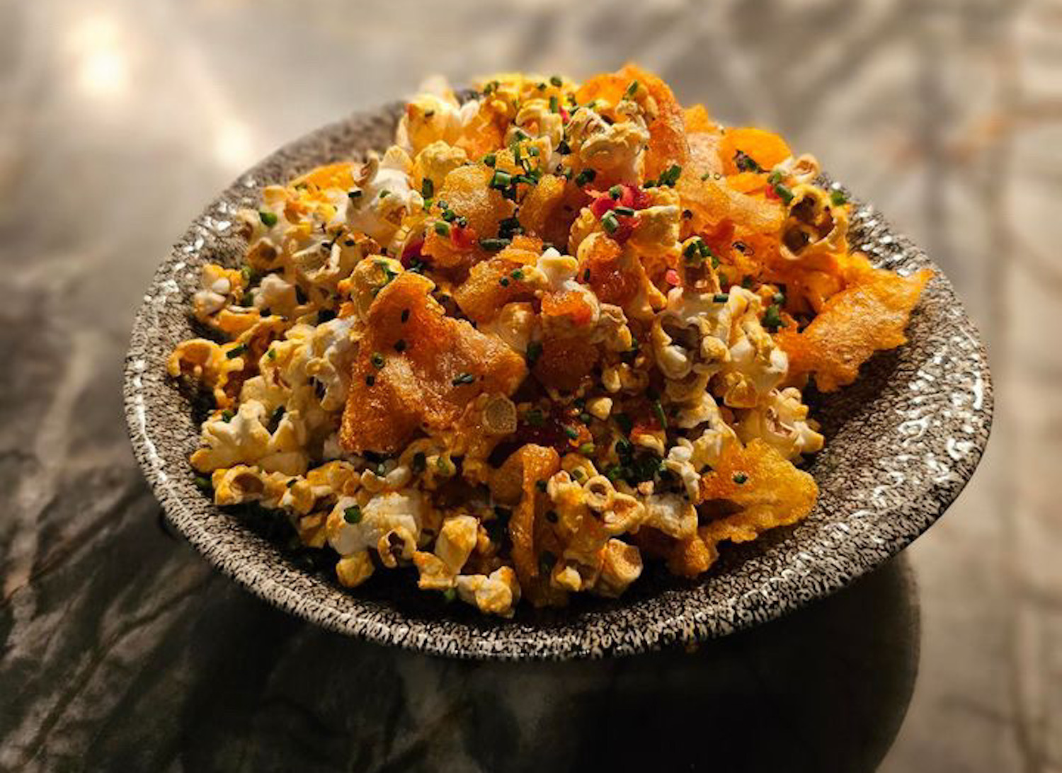 Truffle Popcorn with Beef Chicharron, Calabrian Chili Butter, Truffle Salt and Maple