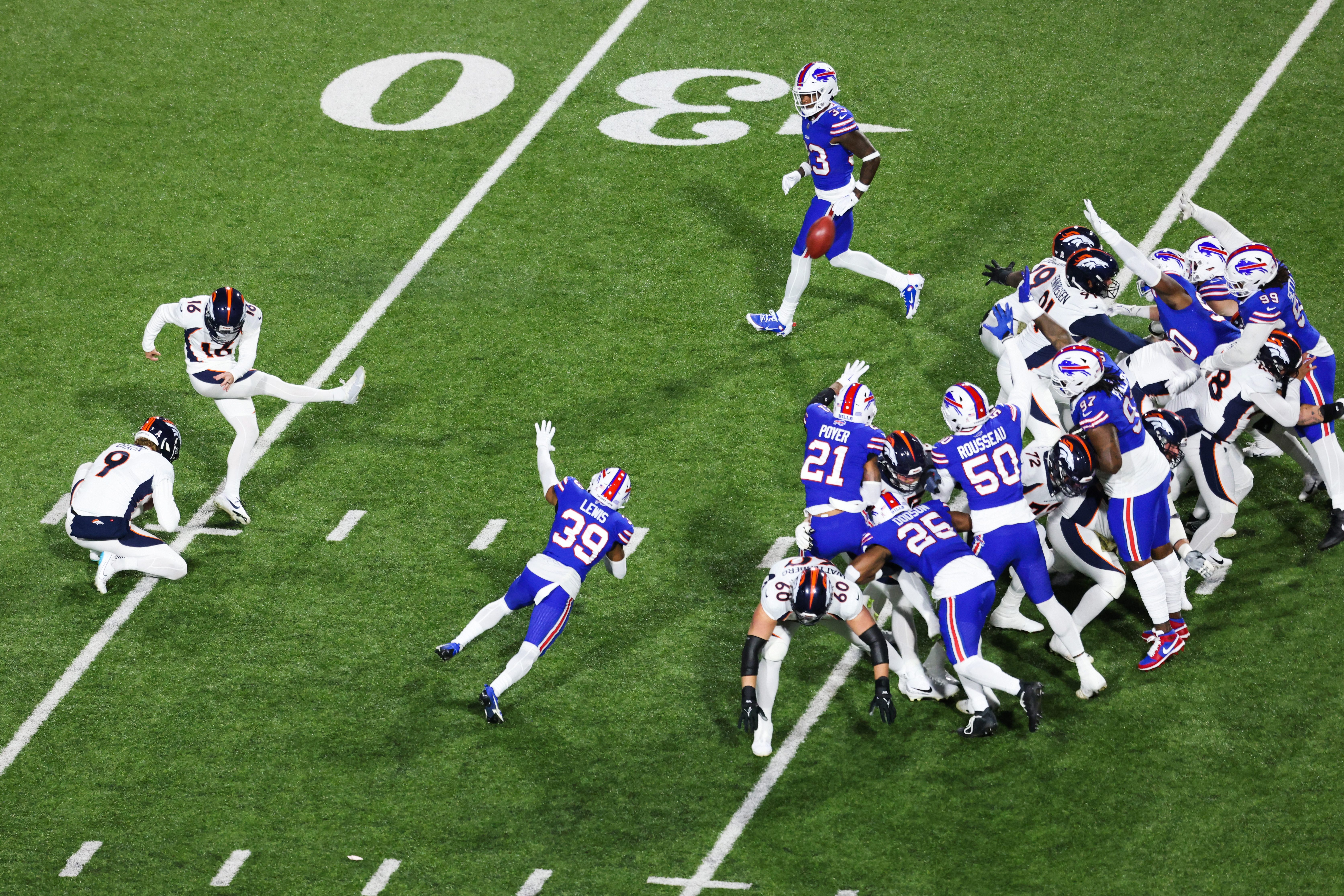 Will Lutz of the Broncos kicks a field goal against the Buffalo Bills.