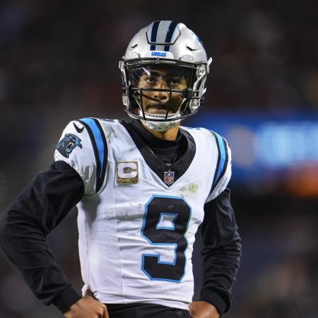 Bryce Young of the Panthers looks on.