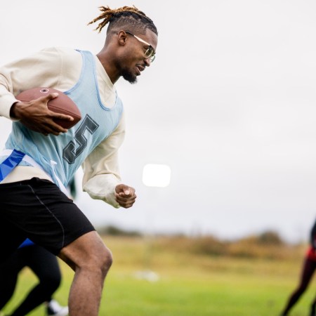 A group of people playing flag football, a sport that the NFL is investing in internationally with a new youth tournament program in France