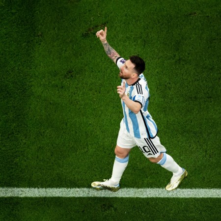 Lionel Messi of Argentina celebrates after scoring the team's first goal via a penalty during the FIFA World Cup Qatar 2022 Final.