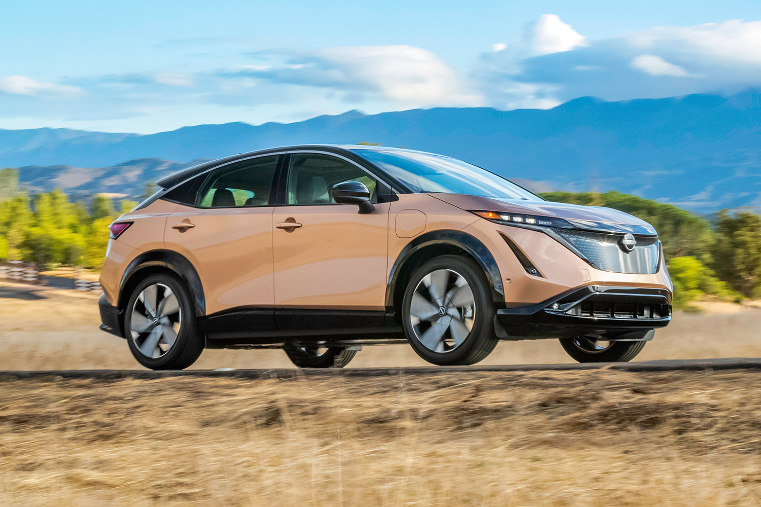 2023 Nissan Ariya, a new electric SUV, driving down the road
