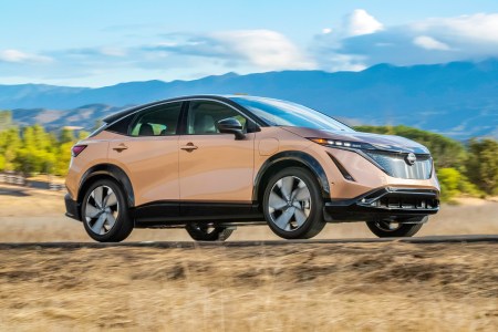 2023 Nissan Ariya, a new electric SUV, driving down the road