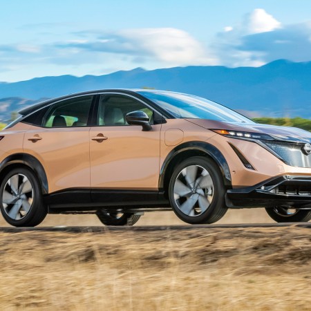 2023 Nissan Ariya, a new electric SUV, driving down the road